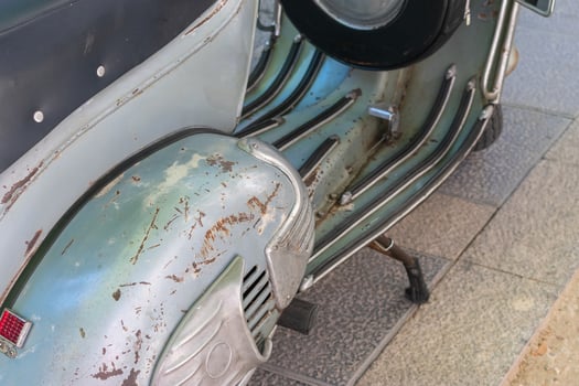 classic motorcycle with badly weathered paintwork photo