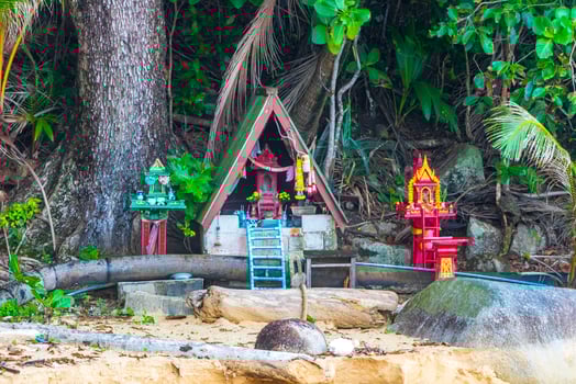 Holy ghost house shrine small temple garden yard village Thailand. photo