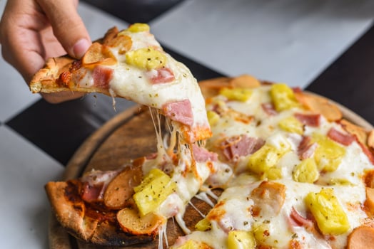 Homemade pizza italian is cooked traditional food - Pizza cheese slice on wooden tray and served on a wooden table photo