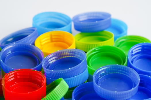 Plastic bottle caps colorful for recycle on white background. photo