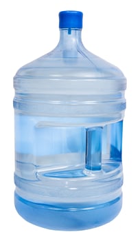 closed 5 gallon plastic bottle with drinking water photo