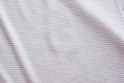 White fabric sport clothing football jersey with air mesh texture background photo