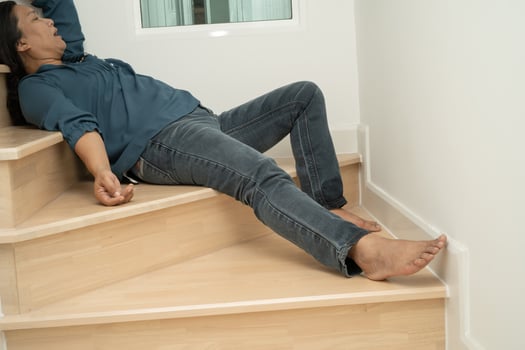 Asian lady woman patient fall down the stairs because slippery surfaces photo
