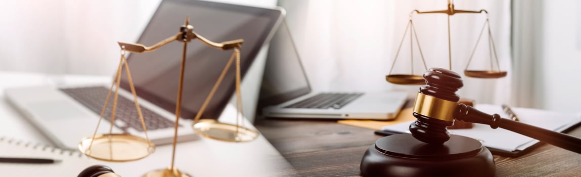 Business and lawyers discussing contract papers with brass scale on desk in office. Law, legal services, advice, justice and law concept picture with film grain effect photo