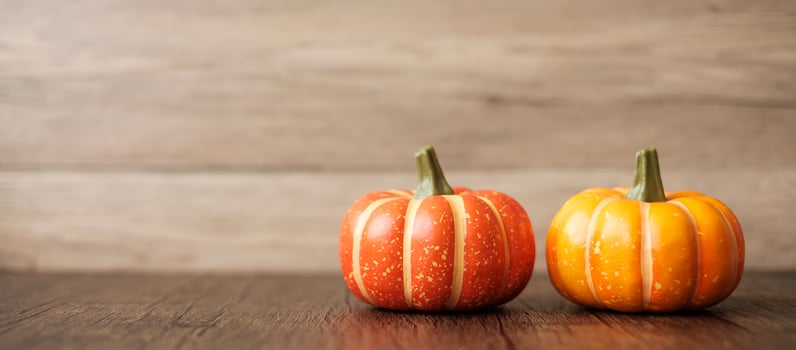 Orange pumpkin on table with copy space for banner background. Happy Halloween day, Hello October, fall autumn season, Festive, party and holiday concept photo