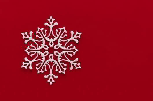 Snow red background. Background with snowflake, Christmas celebration concept. Flat lay photo
