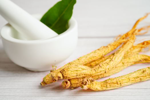 Ginseng roots and green leaf, healthy food. photo