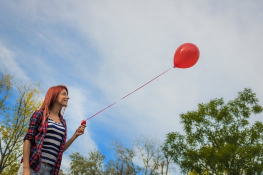 Red balloon and redhead girl. photo