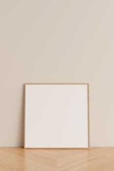 Clean and minimalist front view square wooden photo or poster frame mockup leaning against wall on wooden floor. 3d rendering.