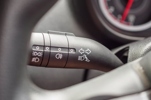 Car light control switch close up photo
