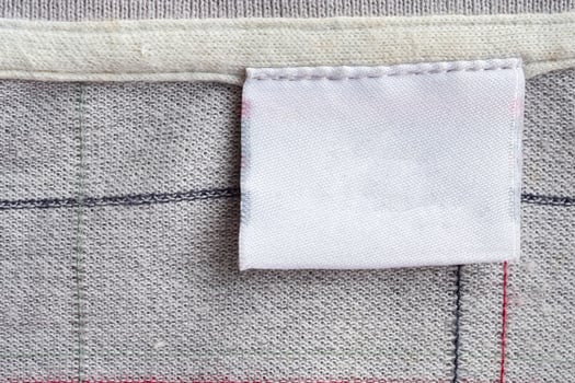 laundry care clothing label on fabric texture photo