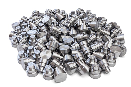batch of shiny steel cnc turned parts isolated on white background photo