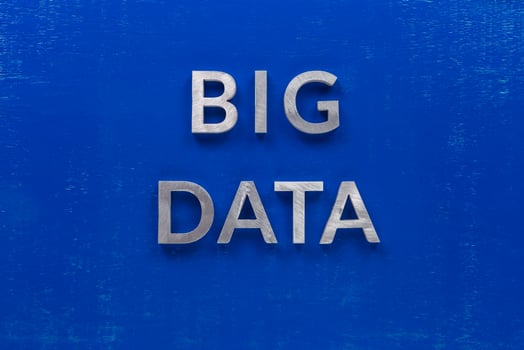 the words big data laid with silver metal characters on blue painted wooden board in central flat lay composition photo