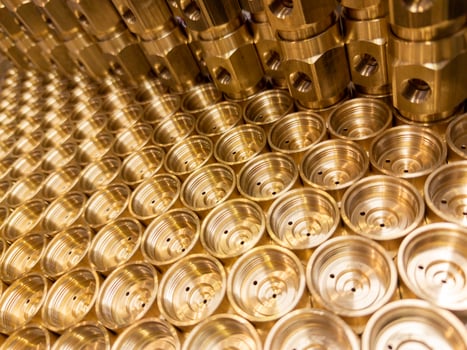 shiny brass metal threaded hexagonal fitting parts, abstract perspective industrial close-up background photo