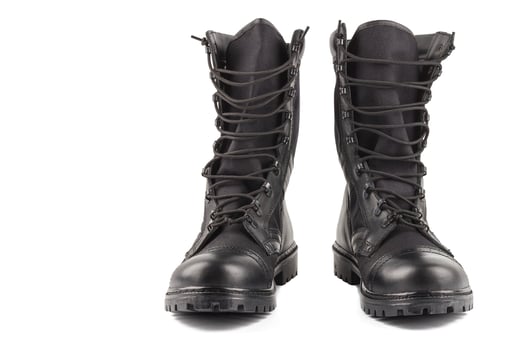 pair of new black lightweight military boots isolated on white background photo