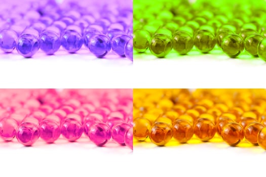 set of colored spherical ball capsules of fish oil selective focus isolated on white background photo