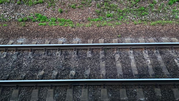 Landscape with a view of the rails and sleepers of the railway photo