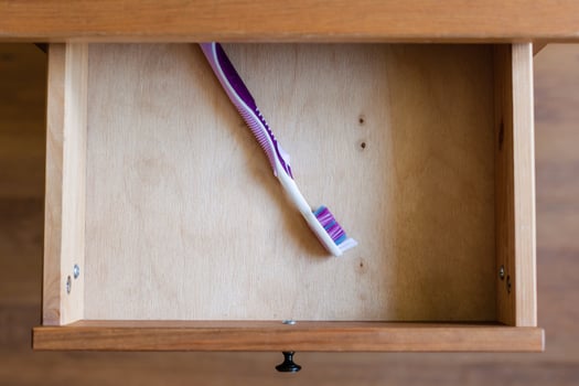 modern toothbrush in open drawer photo