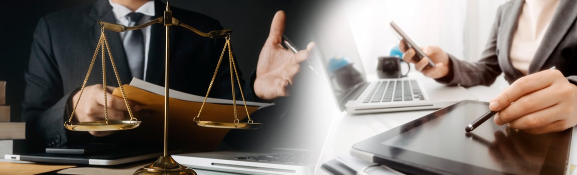 Justice and law concept.Male judge in a courtroom with the gavel, working with, computer and docking keyboard, eyeglasses, on table in morning light photo