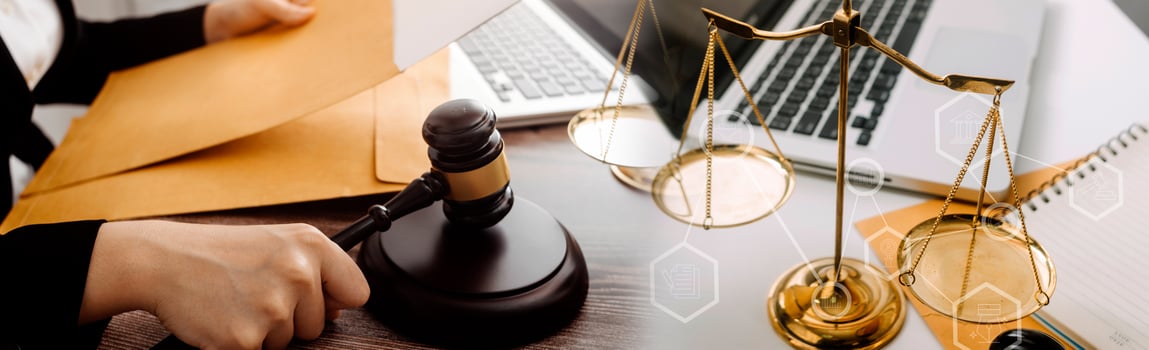 justice and law concept.Male judge in a courtroom on wooden table and Counselor or Male lawyer working in office. Legal law, advice and justice concept. photo