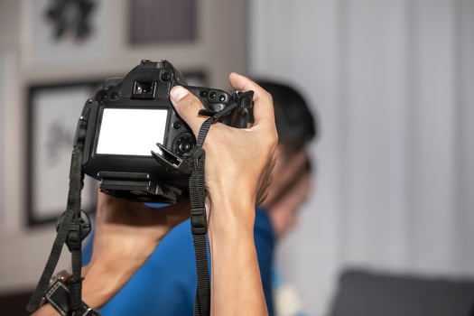Videographer in the backside of camera are shooing and recording video in Wedding Event. photo