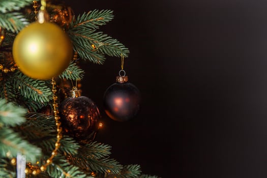 Classic Christmas decorated New Year tree with golden ornament decorations toy and ball photo