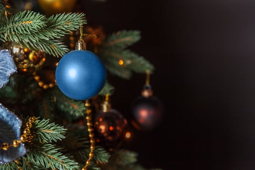 Classic Christmas decorated New Year tree with golden ornament decorations toy and ball photo