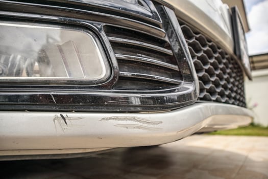 car bumper scratched paint damage photo