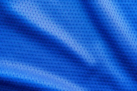 Blue color fabric sport clothing football jersey with air mesh texture background photo