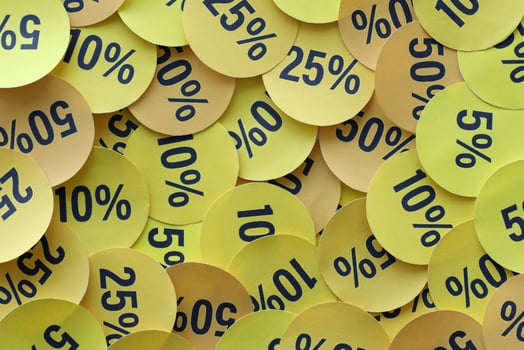 Large amount of stickers with yellow percentage values for black friday or cyber monday sale. Abstract image of discount prices photo