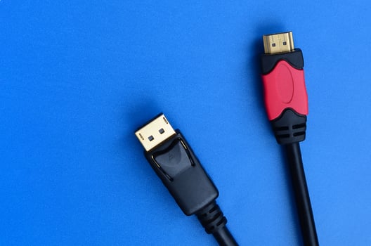 Audio video HDMI computer cable plug and 20-pin male DisplayPort gold plated connector for a flawless connection on a blue background photo