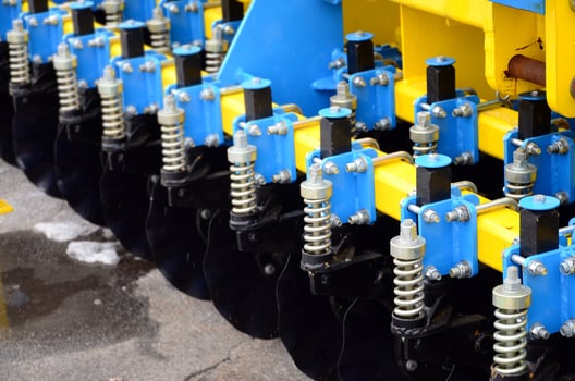 Spring system of agricultural seeder close up photo