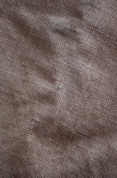 The texture of a very old brown sack cloth. Retro texture with canvas material. Background image with copy space photo