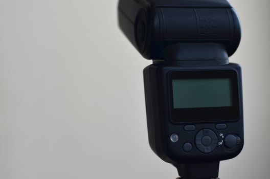 Speedlight gun with trigger set mounted on tripod photo