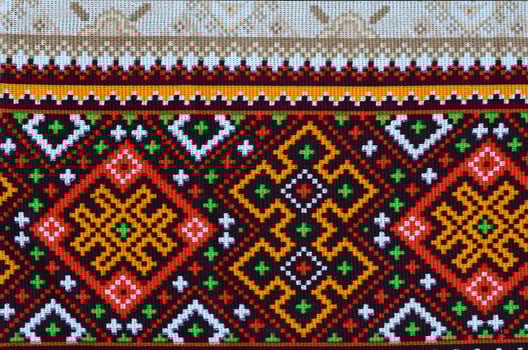 Traditional Ukrainian folk art knitted embroidery pattern on textile fabric photo