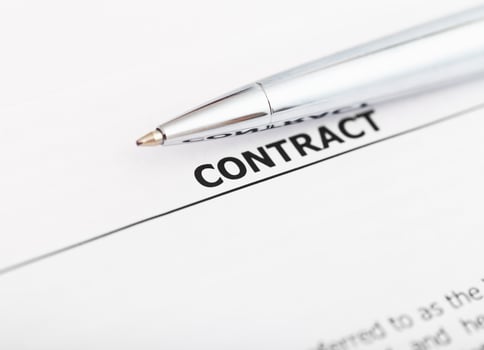 contract and silver pen close up photo