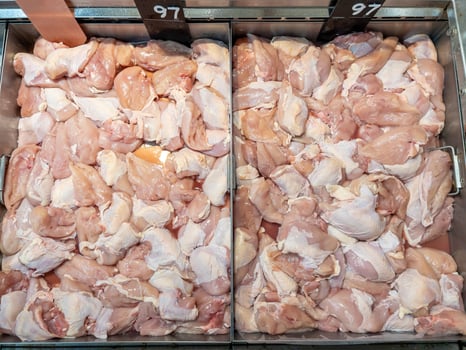 chicken meat from refrigerated section at supermarket. photo