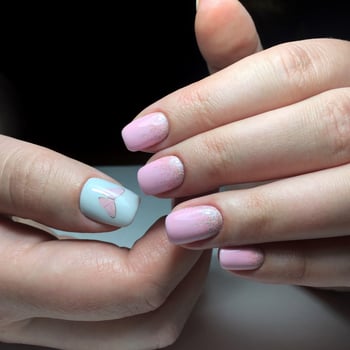Manicure of different colors on nails. Female manicure on the hand photo