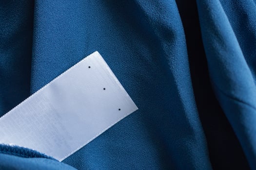laundry care clothing label on blue dress photo