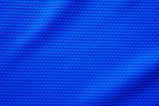 Blue football jersey clothing fabric texture sports wear background, close up top view photo