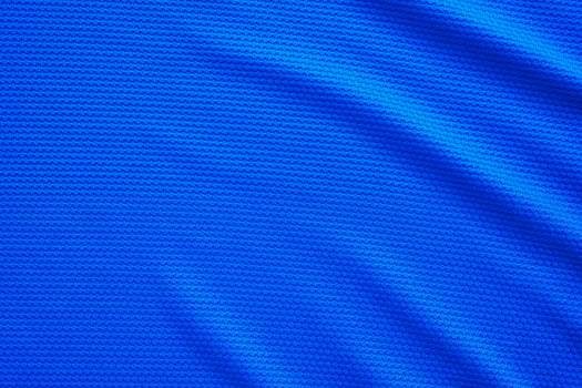 Blue football jersey clothing fabric texture sports wear background, close up top view photo