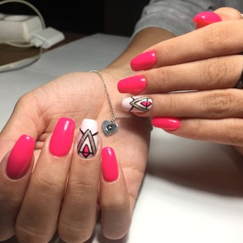Female hands with stylish red manicure on grey background photo