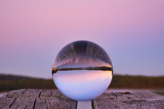 Glass ball on a wooden pier at a Swedish lake at evening hour. Nature Scandinavia photo