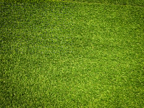 Artificial grass background for design, top view photo