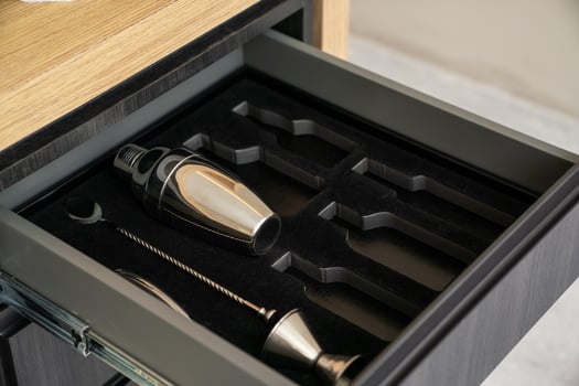 Bartender tools in wooden boxes. shaker and tableware in the drawer. Bartender equipment. photo