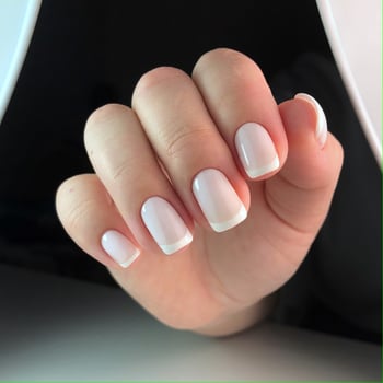 Beautiful woman's nails with beautiful french manicure photo