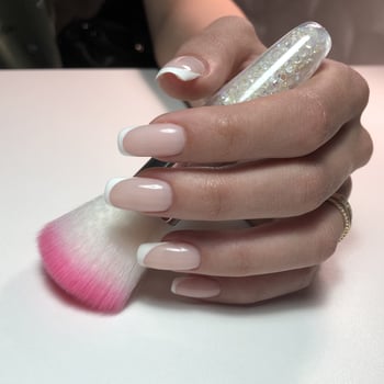 French manicure on the nails. French manicure design. Manicure gel nail polish photo