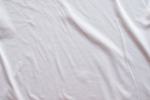 White fabric sport clothing football jersey with air mesh texture background photo