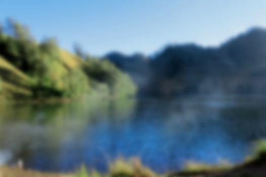 Blurred View of mount bromo at sunrise. Blur mountain background and nature landscape photo