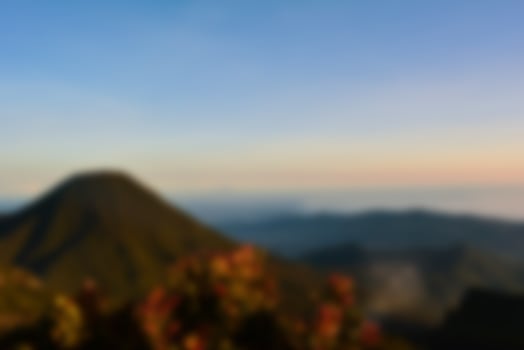 Blurred landscape blue sky with clouds, beautiful fantasy pastel colorful landscape background, gradient sky, sunrise with mountains in distant photo